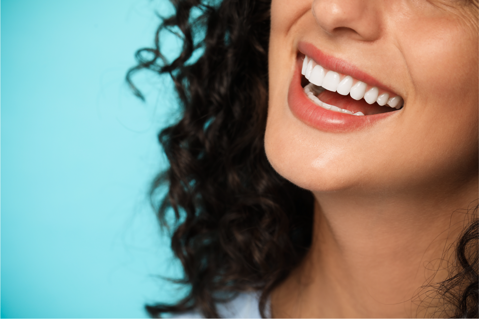 Woman smiling after installing Dental Crown