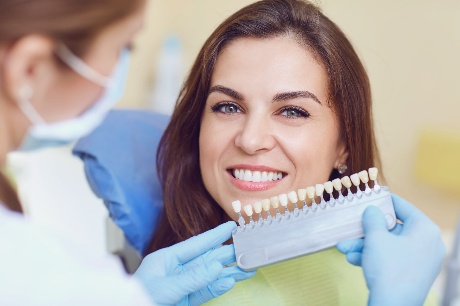 Woman smiling while installing a dental crown