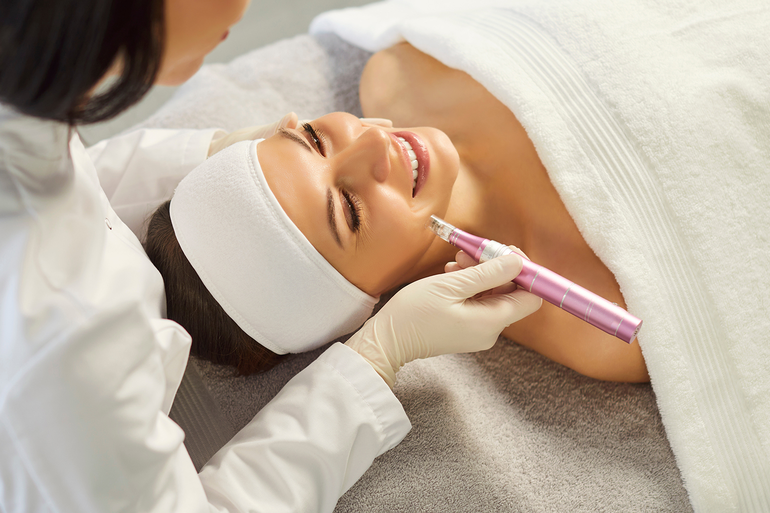 Close-up of a woman receiving mesotherapy treatment on her cheek to enhance skin texture.